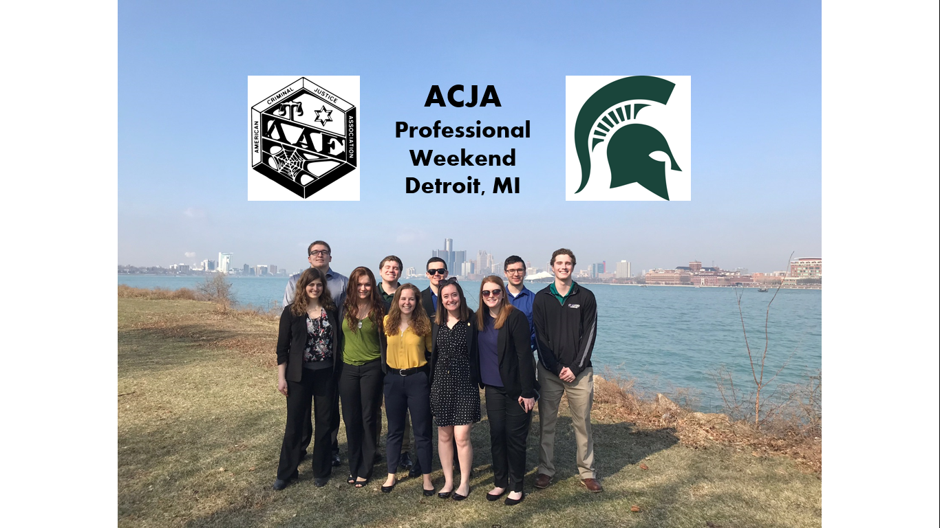 ACJA students standing along river